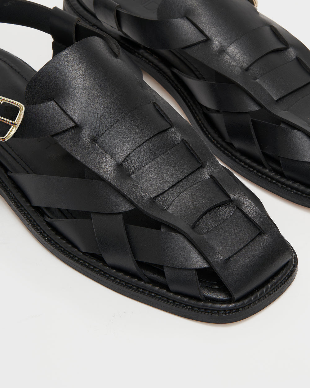 Luxury fisherman sandals for women that are made from soft leather and don't cause blisters. Unique design fisherman sandals that are comfortable. Made from premium black leather, and featuring a polished gold buckle. Elevated and timeless classic fisherman sandals with a twist.