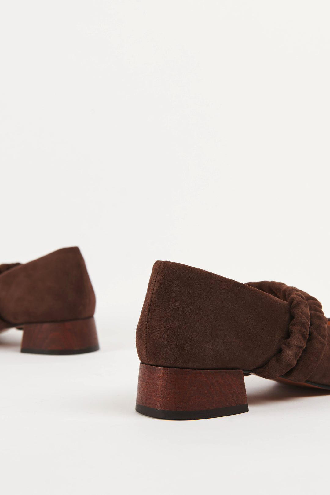 Mid-heel low-heel mary jane pump made from premium dark chocolate brown suede. This shoe features two scrunchy elasticated straps for added support. The lining is made from veg-tan buttery soft leather. The heel is made from wood and sits at a height of 3cm, and has a rubber sole for non-slip wear. Perfect office shoe for women. Day-to-night mary jane shoes for women in sizes EU 36 - 41. Pinterest aesthetic mary jane ballerina shoes.