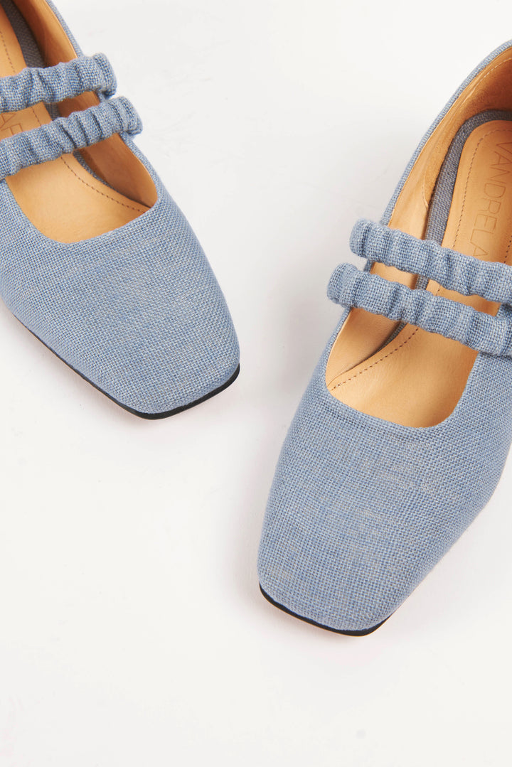 Mid-heel low-heel mary jane pump made from European light powder baby blue linen fabric. This shoe features two scrunchy elasticated straps for added support. The lining is made from veg-tan buttery soft leather. The heel is made from wood and sits at a height of 3cm, and has a rubber sole for non-slip wear. Perfect office shoe for women. Day-to-night mary jane shoes for women in sizes EU 36 - 41. Pinterest aesthetic mary jane ballerina shoes.