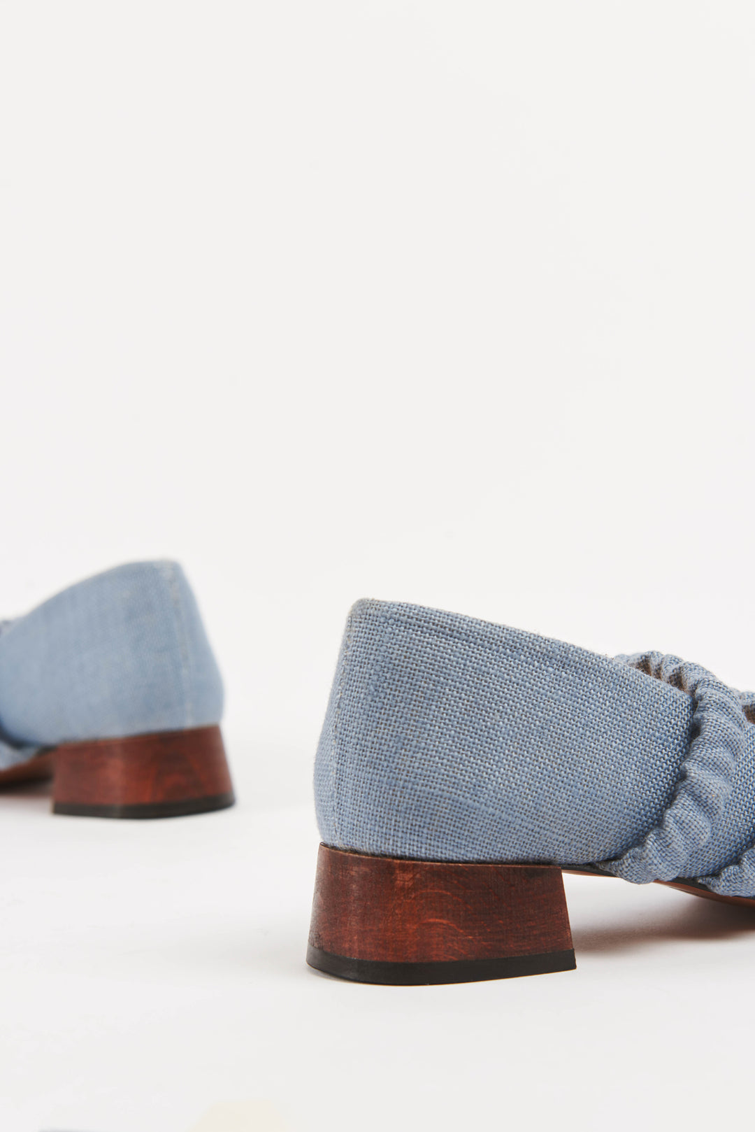 Mid-heel low-heel mary jane pump made from European light powder baby blue linen fabric. This shoe features two scrunchy elasticated straps for added support. The lining is made from veg-tan buttery soft leather. The heel is made from wood and sits at a height of 3cm, and has a rubber sole for non-slip wear. Perfect office shoe for women. Day-to-night mary jane shoes for women in sizes EU 36 - 41. Pinterest aesthetic mary jane ballerina shoes.