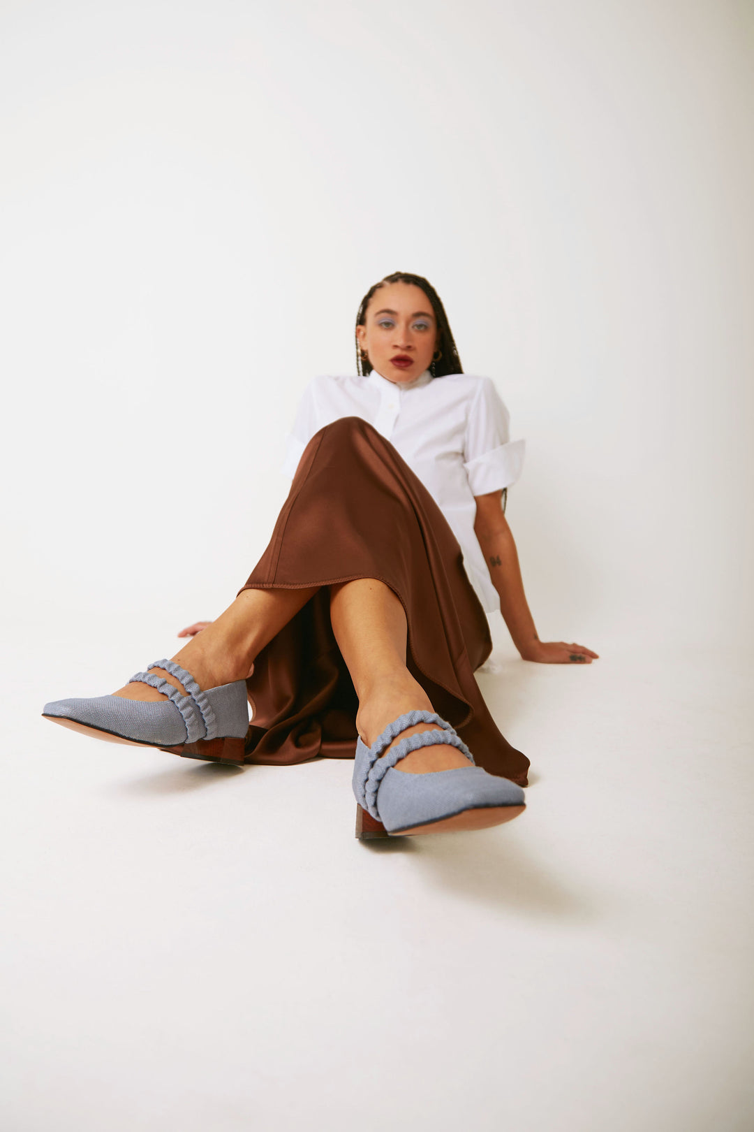 Mid-heel low-heel mary jane pump made from European light powder baby blue linen fabric. This shoe features two scrunchy elasticated straps for added support. The lining is made from veg-tan buttery soft leather. The heel is made from wood and sits at a height of 3cm, and has a rubber sole for non-slip wear. Perfect office shoe for women. Day-to-night mary jane shoes for women in sizes EU 36 - 41. Pinterest aesthetic mary jane ballerina shoes.